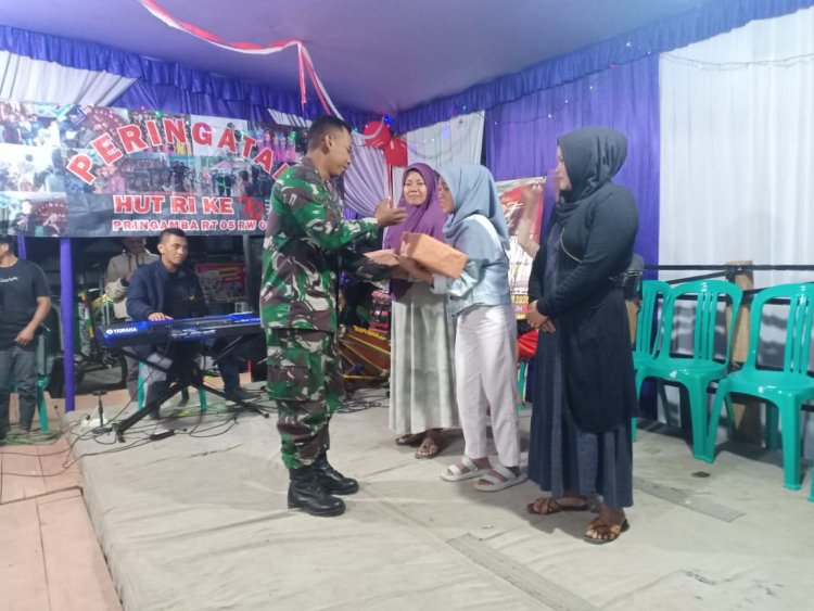 Babinsa Koramil 12 Sigaluh Bagikan Hadiah Pada Pemenang Lomba